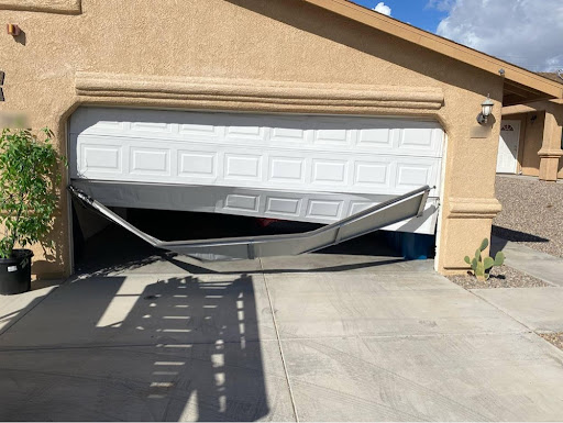 Damaged garage door repair Dallas TX - bent panels requiring professional service
