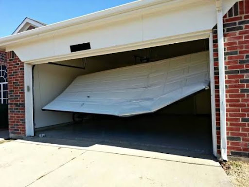 Dallas garage door off track repair - bent white door needing emergency service