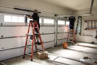 Dallas garage door installation technician on ladder mounting new system