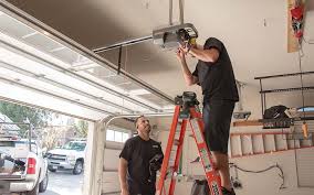 Dallas garage door opener repair team - two technicians servicing ceiling-mounted opener