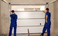 Dallas garage door team installing new panel section
